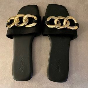 Black and gold sandals, tried on but never worn.  Size 9.